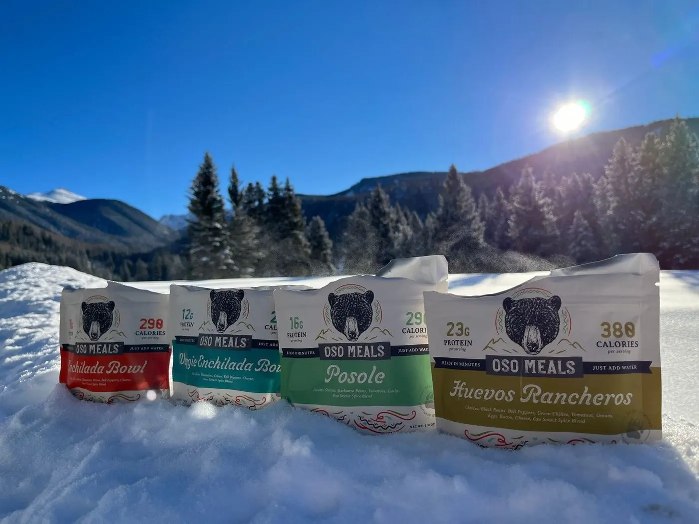 Four Oso pouches lined up in the snow
